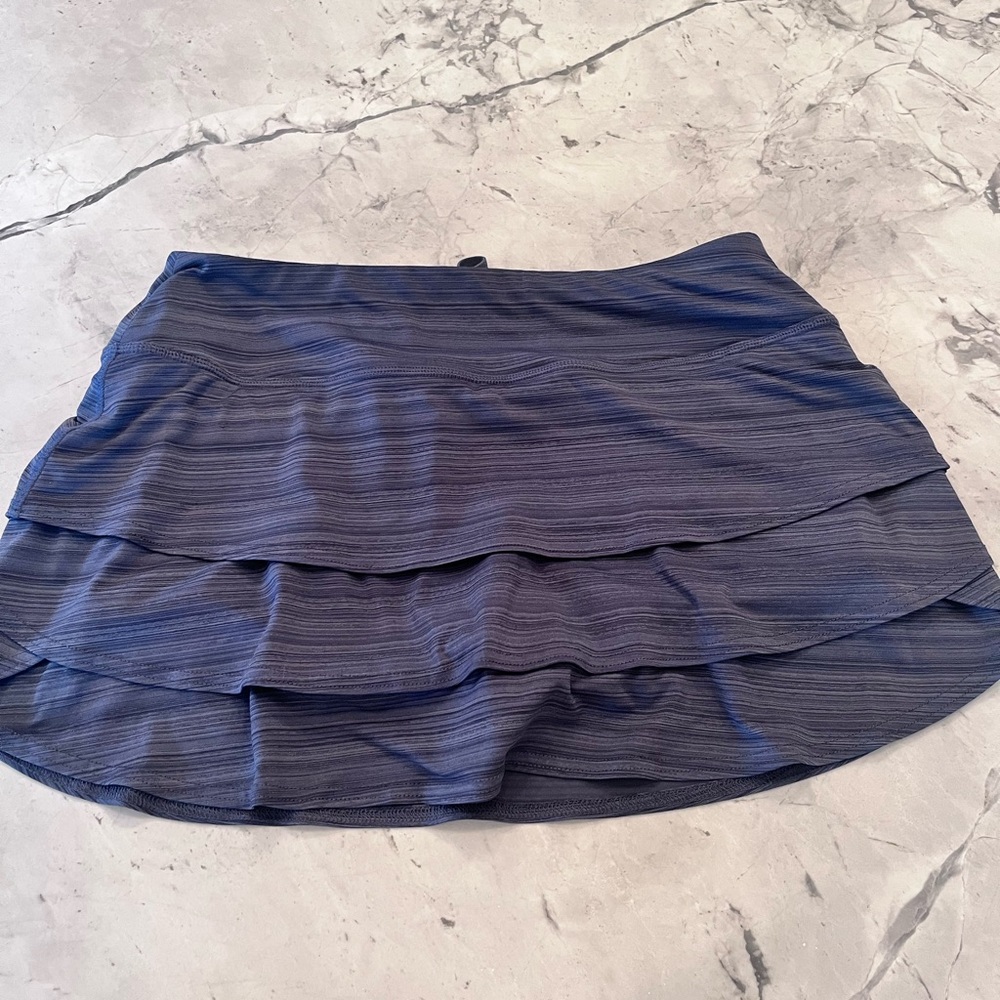 Navy stripped Athleta tennis skirt size Medium. 13” length.